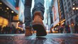 Close-up of a traveler's feet walking along a bustling city street, capturing the rhythm and movement of urban exploration and adventure.
