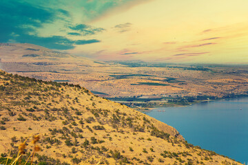 Wall Mural - sunrise over the sea. mountain coast in the morning. seascape during sunrise. sea of galilee israel