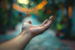 hand reaching out for assistance, with a blurred background emphasizing the focus on support and personal assistance, evoking feelings of empathy and compassion.