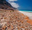 coast of an island in the Indian Ocean. Emerald water, virgin beaches, wild rocky shores. Amazing landscape. Yemen. Socotra. Vertical panorama