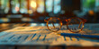 © alenagurenchuk - Pair of glasses sitting atop an open financial newspaper on a desk banner