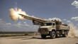 A multiple rocket launcher mounted on a truck is firing rockets.

