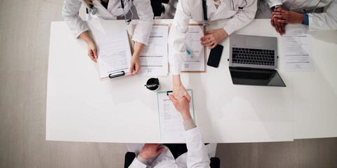 Poster - Young Doctor Sitting At Job Interview