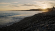 Low angle shot of sunset on a pebble beach of Nice