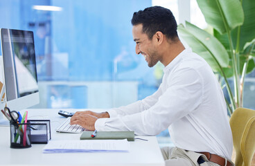 Wall Mural - Computer, smile and typing with business man at desk in office for administration, research or report. Email, internet and technology with happy young employee in workplace for online planning