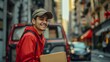 Smiling shipment service man, a mid adult courier in uniform, holding a customer order, looking up while unloading a cardboard box from the delivery truck. Portrait of a worker.