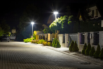 Wall Mural - safety night street in residential area, modern street lights