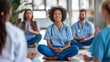 © Michael - Smiling nurse practicing meditation with colleagues