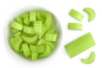 Wall Mural - fresh celery in ceramic bowl isolated on white background. Top view. Flat lay