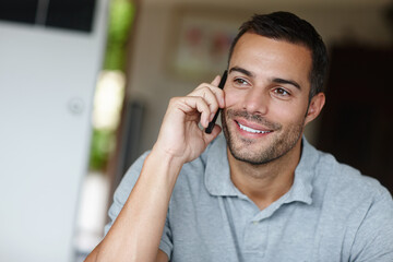 Canvas Print - Man, smile and happy with phone call discussion in home for new work, freelancing or good news. Person, confident and relaxed communication on mobile for remote job, online interview or employment