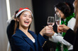Happy asian female drink wine at Business party and success celebration - Group of diverse business people colleagues or employees together drinking champagne at event party. achievement