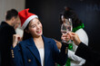 Happy asian female drink wine at Business party and success celebration - Group of diverse business people colleagues or employees together drinking champagne at event party. achievement