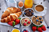 Fototapeta  - Breakfast served with coffee, juice, croissants and fruits