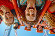 People upside-down on a roller coaster inversion, thrill ride, theme park, amusement, summer fun, vacation