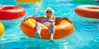 Senior citizen woman floating on a lazy river ride inner tube at a water park, vacation, tropical, retirement, travel, wide