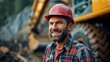 Portrait of happy smiling working man in helmet and work clothes near the excavator on career