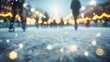 Spectacular blurred perspective of a winter atmosphere on the ice rink with skaters and lights. night sky. 