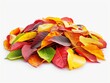 A pile of colorful autumn leaves on a white background. The leaves are of various colors, including red, yellow, and green. Concept of warmth and nostalgia