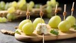 canape cheese snack skewered on bamboo with white grapes