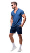 Isolated handsome young man wearing blue shorts and blue tshirt, walking, cutout on transparent background, ready for architectural visualisation.png
