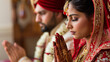 copy space, stockphoto, Young Indian couple praying in a temple, close-up portrait. Hidden camera photo of a young Indian couple praying. Hindu religion.