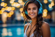 Trendy stunning young woman smiling wearing a bikini and headphones with a beautiful bokeh background