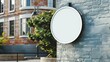 mock up of a white empty round sign on the wall of a beautiful street 