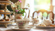 Elegant table setting for tea party with cakes and cupcakes in English manor. Vintage style.