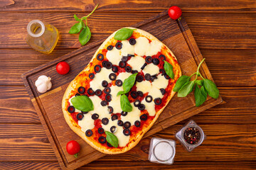 Canvas Print - Traditional italian pizza with vegetables olives and  basil