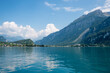 view over lake Brienzersee to lake shore and mountains, Bernese Oberland