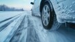 Car driving on snowy road in winter conditions - A dynamic view of a car in motion on a snowy road, capturing the essence of winter travel and the challenge of driving in cold weather conditions