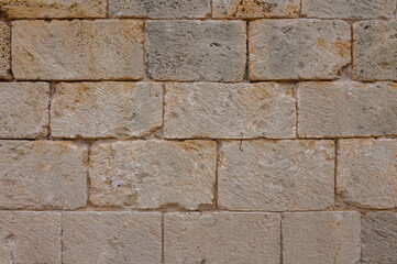 Texture of an ancient brick wall made of sandstone. Archaeological excavations 1