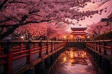 A Red Bridge Spans A Body Of Water Underneath Blooming Cherry Blossom Trees. Generative AI