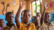 © Sittipol  - African children raising their hands in a classroom