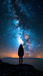 a girl looking to the sky and see the galaxy