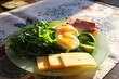 Morning breakfast with eggs and salad in the sun.