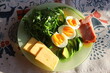 Morning breakfast with eggs and salad in the sun.