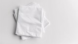 Fototapeta Panele - A white napkin mockup with utensils and a blank towel for branding purposes.