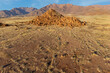 Scenic desert landscape with rocks and arid grassland, Brandberg mountain, Namibia.