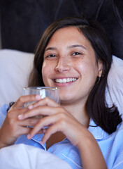 Sticker - Woman, tea and portrait in bed, night and happy for wellness, hydration or detox for sleep in home. Girl, person and smile in bedroom with coffee for drink, health and digestion on holiday in Naples