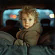 © sergio - A little boy in a car seat with his eyes closed. Generative AI.