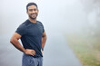 Portrait, fog and man outdoor for exercise with runner in nature for cardio, health and wellness. Fitness, workout and run on a misty morning in park, training for marathon or race with confidence