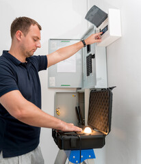 A technician works with a demo kit of the smart home system