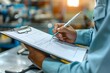 © AgungRikhi - Professional inspecting a checklist on a clipboard