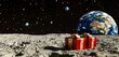 Gifts wrapped in Christmas paper on the surface of the moon. In the background, the blue planet Earth and the black sky. Christmas.