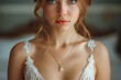 portrait of beautiful bride girl with jewelry diamond pendant at morning wedding fees