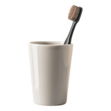 Fototapeta Młodzieżowe - A black toothbrush in a white cup.