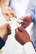 © peopleimages.com - Diversity, hands and business people with puzzle for unity or collaboration with joint effort for project. Group, teamwork and pieces together for planning or partnership, union and engagement.