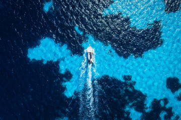 Wall Mural - vacation and leisure. aerial view on fast boat on blue mediterranean sea at sunny day. fast ships on