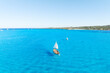Sail yacht on the sea as a background. .Sea and waves from top view. Blue water background from top view. Top view from drone. Summertime vacation. Travel image